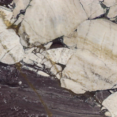 Close-up of Karyamar’s Dark Violet natural stone, showcasing deep violet tones and intricate veining, perfect for luxury interiors and architectural applications