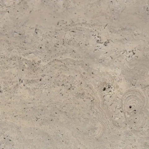 Close-up of Karyamar’s Travertine Karya natural stone, showcasing warm beige tones and delicate veining, perfect for timeless architectural and interior applications.