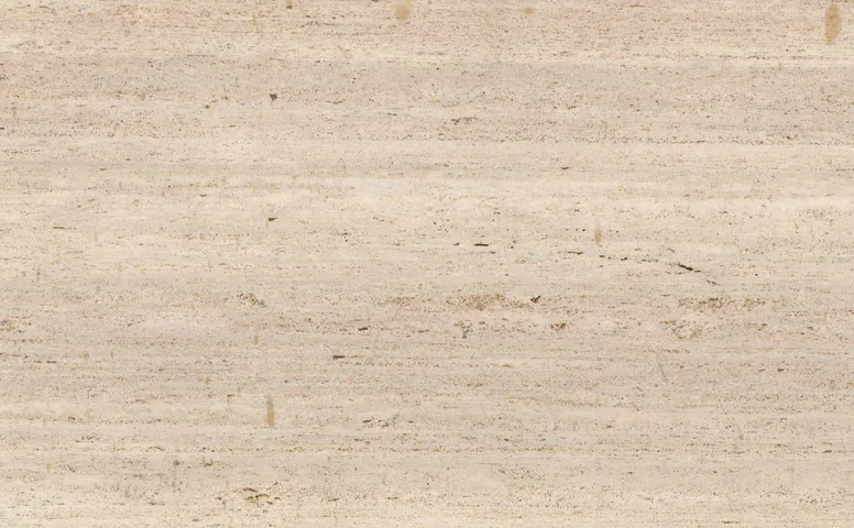 Close-up of Karyamar’s Travertine Greige natural stone, showcasing warm beige and soft gray hues with delicate veining, perfect for luxury interiors and architectural projects