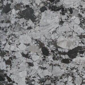 Close-up of Karyamar’s Light Conglomerate natural stone with beige and gray tones interwoven with stone fragments, ideal for architectural and interior applications