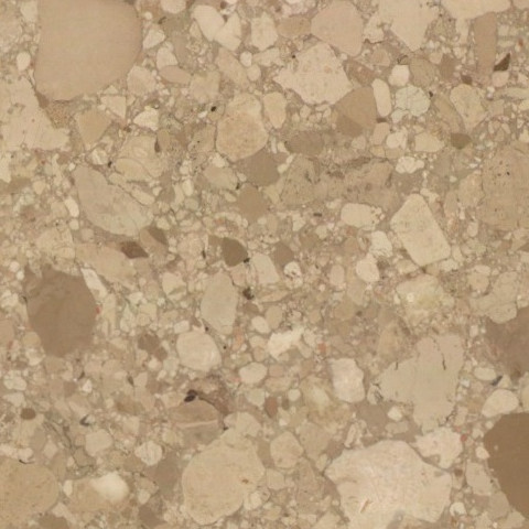 Close-up of Karyamar’s Beige Conglomerate natural stone with warm beige tones and dynamic natural aggregates, ideal for architectural and interior applications