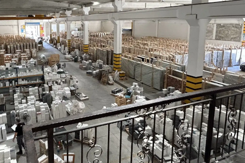 Karyamar Marble Showroom featuring a display of premium marble slabs and natural stones