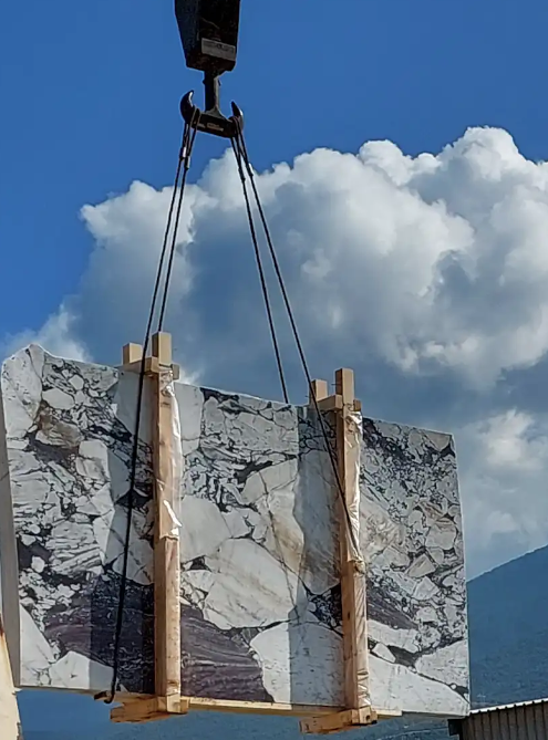 Close-up of Karyamar’s Dark Violet natural stone, showcasing deep violet tones and intricate veining, perfect for luxury interiors and architectural applications