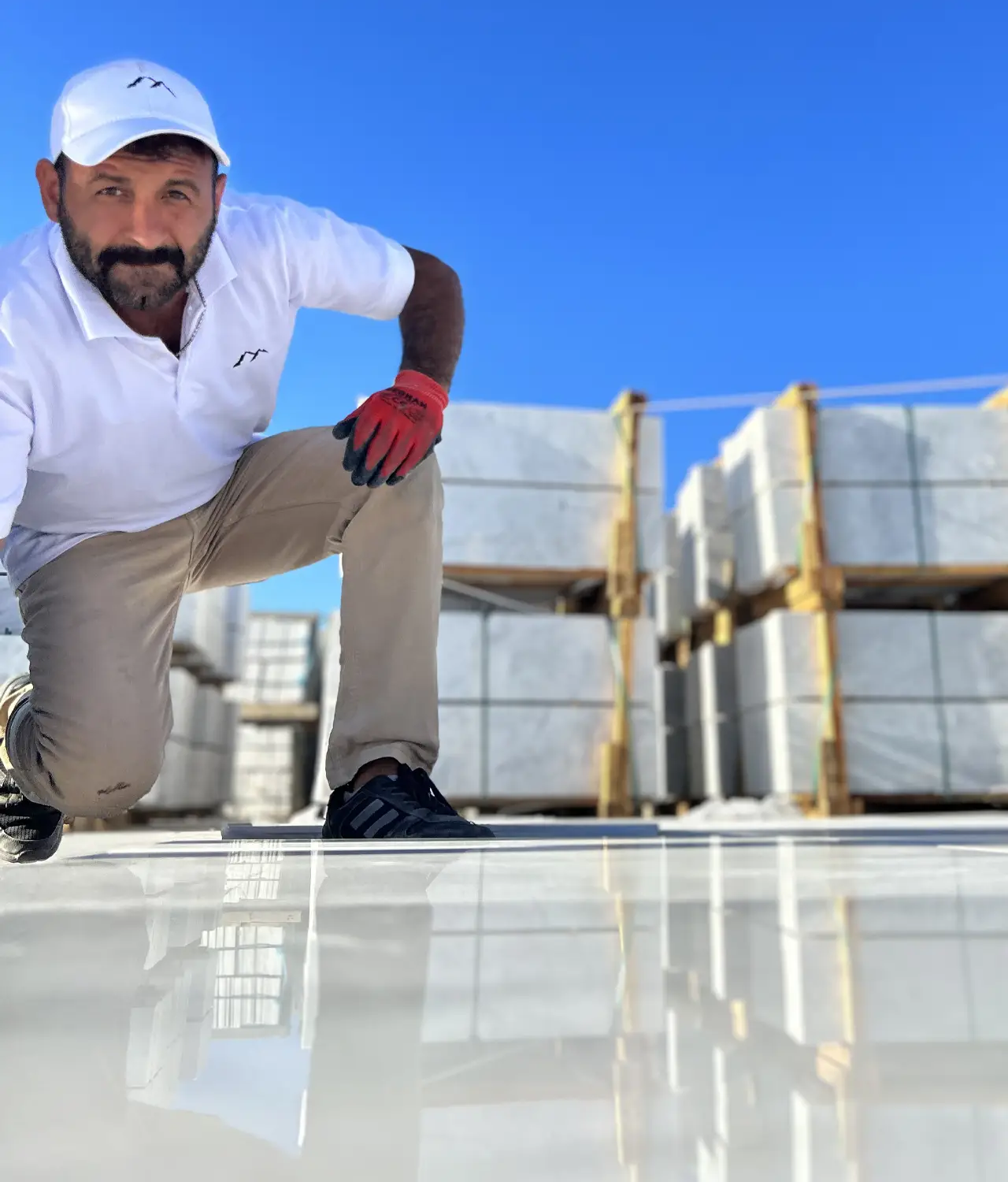 Turkish Natural Stone Inspector Performing Dry Lay Inspection of Marble Tiles.