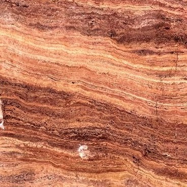 Close-up of Karyamar’s Terra Flame natural stone with rich terracotta tones and fiery patterns, perfect for bold and elegant designs