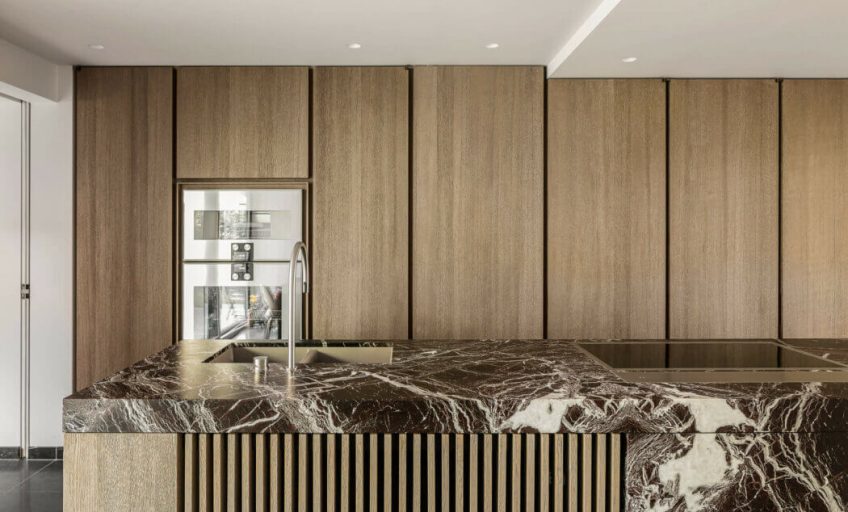 Close-up of Karyamar’s Cherry natural stone with deep red hues and subtle veining, perfect for luxury interior and architectural applications