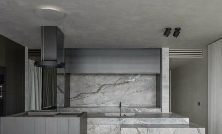 Close-up of Karyamar’s Deep Brown natural stone with deep chocolate hues and intricate veining, perfect for luxury interiors and architectural projects