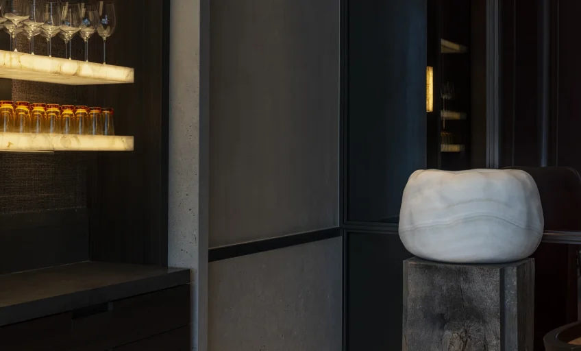 Close-up of Karyamar’s True White Onyx natural stone, showcasing its pure white translucency and delicate veining, perfect for backlit luxury interior applications