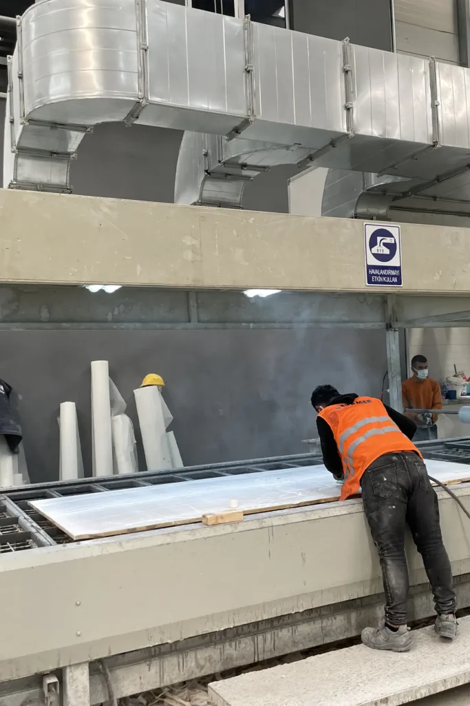 Karyamar team inspecting marble blocks to ensure top-tier quality for production.